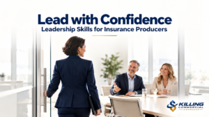 Insurance producer confidently entering a meeting with two business leaders.