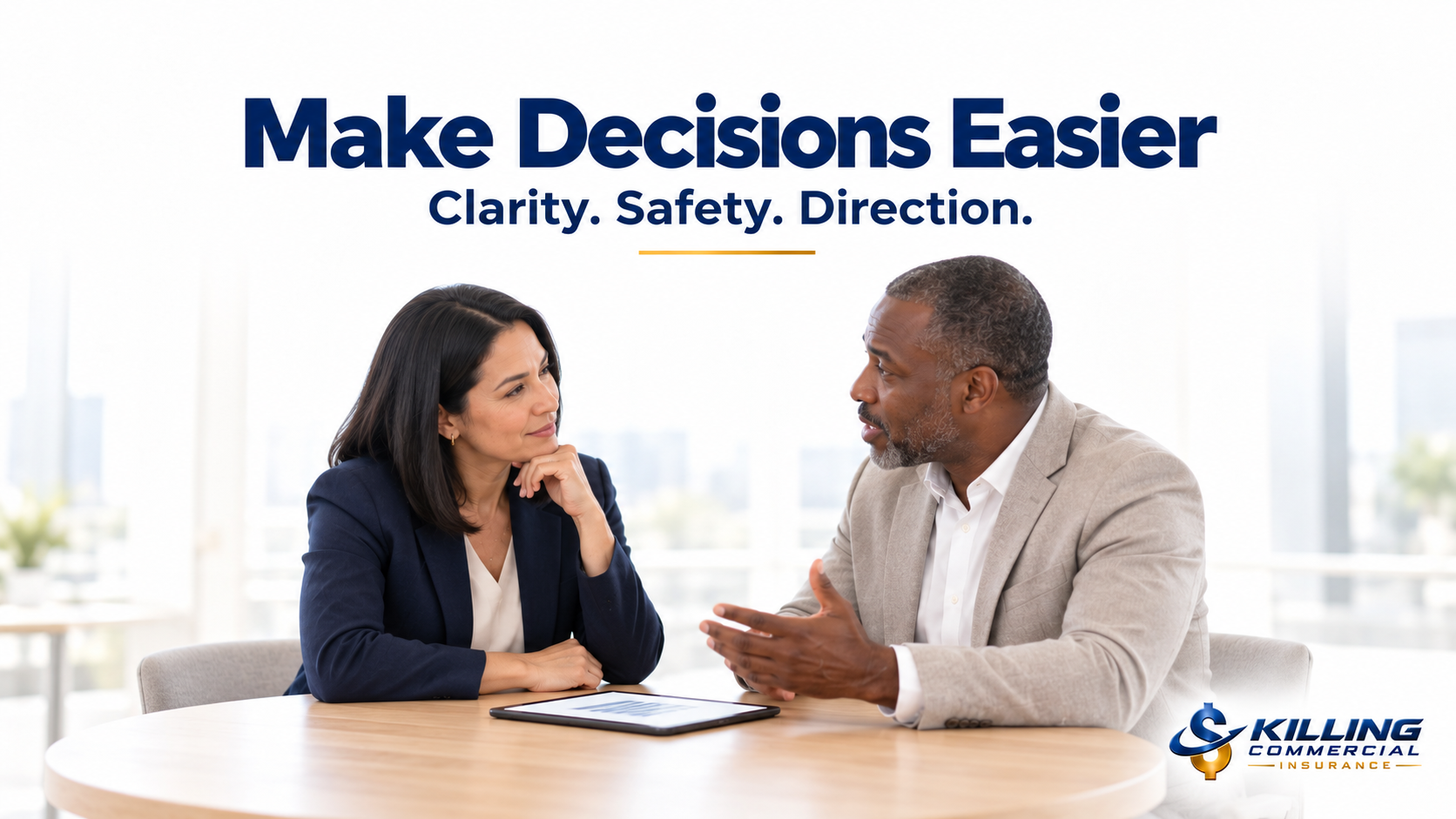Insurance adviser listening attentively as a business owner discusses his concerns.